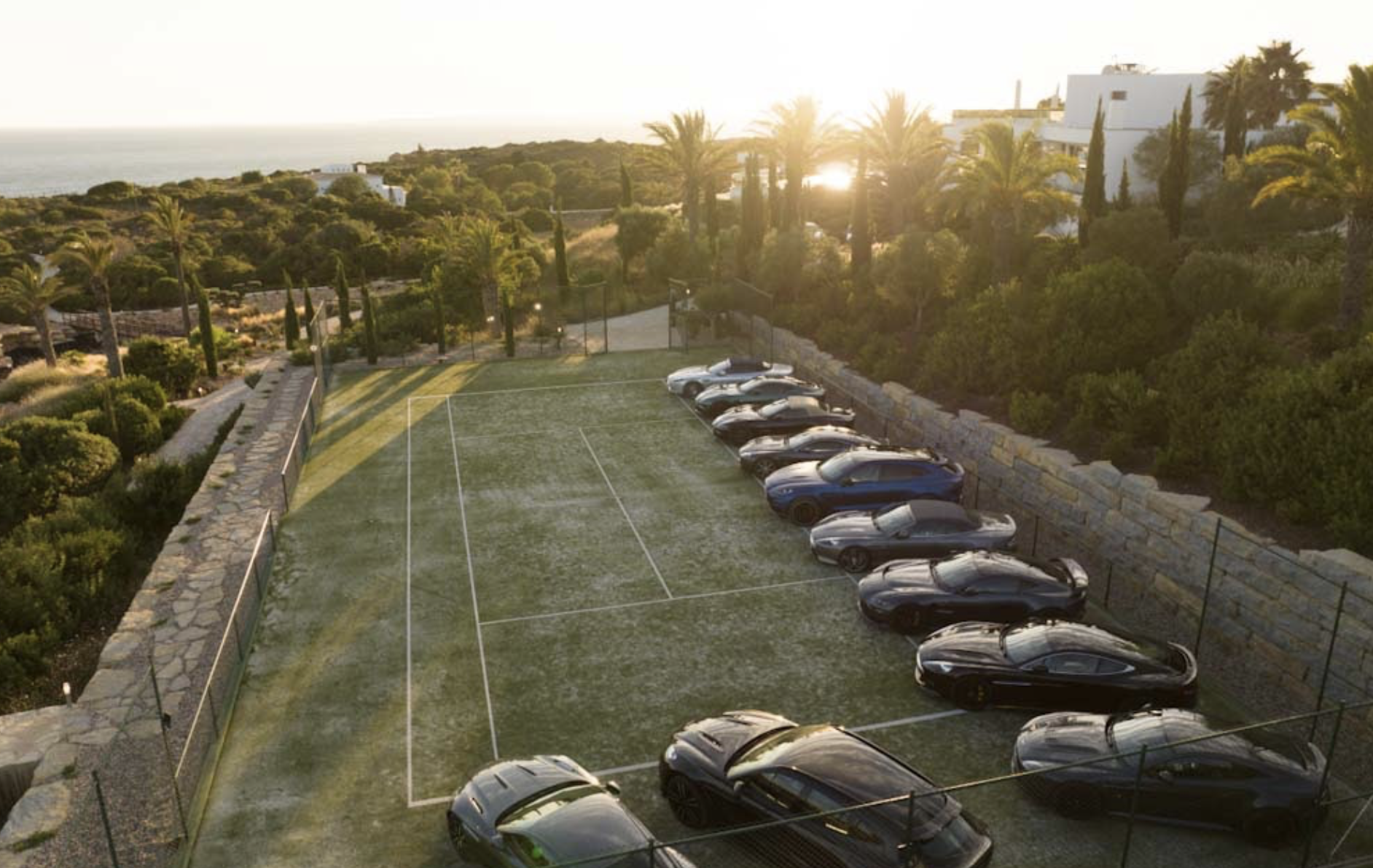 Cars on grass tennis court event